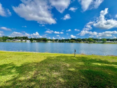 LAKEFRONT, SELLER IS VERY MOTIVATED, BRING ALL OFFERS! Home is on Water Oak Country Club Estates in Florida - for sale on GolfHomes.com, golf home, golf lot