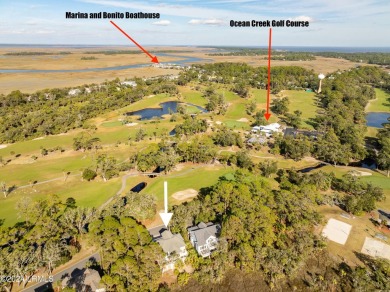 Discover your dream coastal retreat with this stunning reverse on Ocean Creek Golf Course in South Carolina - for sale on GolfHomes.com, golf home, golf lot