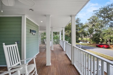 Discover your dream coastal retreat with this stunning reverse on Ocean Creek Golf Course in South Carolina - for sale on GolfHomes.com, golf home, golf lot