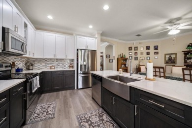 Nestled in the highly sought-after community of Plantation Palms on Plantation Palms Golf Club in Florida - for sale on GolfHomes.com, golf home, golf lot