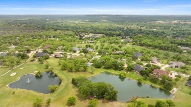 Discover your dream home nestled in coveted Pecan Plantation on Pecan Plantation Country Club in Texas - for sale on GolfHomes.com, golf home, golf lot