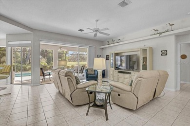 Gracefully set along the prestigious Calusa Lakes Golf Course on Calusa Lakes Golf Club in Florida - for sale on GolfHomes.com, golf home, golf lot