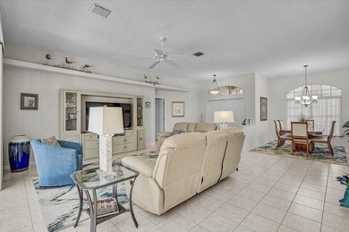 Gracefully set along the prestigious Calusa Lakes Golf Course on Calusa Lakes Golf Club in Florida - for sale on GolfHomes.com, golf home, golf lot