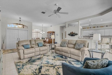 Gracefully set along the prestigious Calusa Lakes Golf Course on Calusa Lakes Golf Club in Florida - for sale on GolfHomes.com, golf home, golf lot