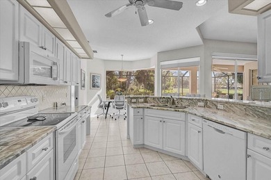 Gracefully set along the prestigious Calusa Lakes Golf Course on Calusa Lakes Golf Club in Florida - for sale on GolfHomes.com, golf home, golf lot