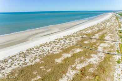 Discover coastal living with this stunning oceanfront cottage on Ocean Point Golf Links in South Carolina - for sale on GolfHomes.com, golf home, golf lot