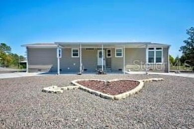 Welcome to your dream abode, nestled on a desirable corner lot on Brookridge Country Club in Florida - for sale on GolfHomes.com, golf home, golf lot