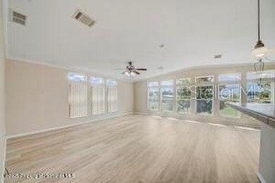 Welcome to your dream abode, nestled on a desirable corner lot on Brookridge Country Club in Florida - for sale on GolfHomes.com, golf home, golf lot