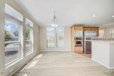 Welcome to your dream abode, nestled on a desirable corner lot on Brookridge Country Club in Florida - for sale on GolfHomes.com, golf home, golf lot