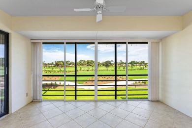 Experience timeless comfort and sweeping double fairway views in on Quail Ridge Golf Course and Country Club in Florida - for sale on GolfHomes.com, golf home, golf lot