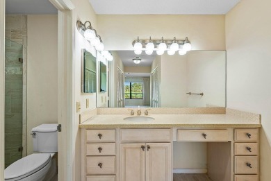 Experience timeless comfort and sweeping double fairway views in on Quail Ridge Golf Course and Country Club in Florida - for sale on GolfHomes.com, golf home, golf lot