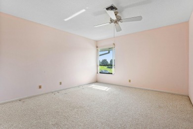 Experience timeless comfort and sweeping double fairway views in on Quail Ridge Golf Course and Country Club in Florida - for sale on GolfHomes.com, golf home, golf lot