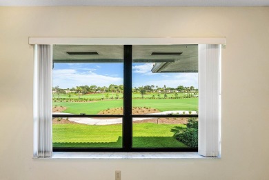 Experience timeless comfort and sweeping double fairway views in on Quail Ridge Golf Course and Country Club in Florida - for sale on GolfHomes.com, golf home, golf lot