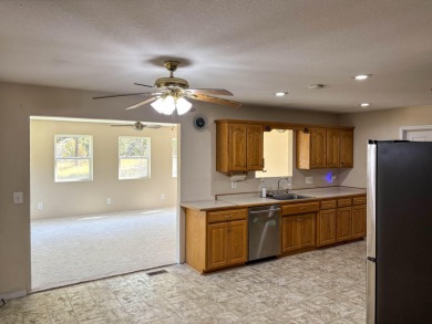 Sitting on a high peninsula in Janian Hills Subdivision, this 3 on Lost Woods Golf Course in Missouri - for sale on GolfHomes.com, golf home, golf lot