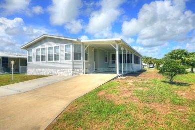 Looks like a Model Beautiful 2018 Jacobsen on highly desired on Barefoot Bay Golf Course in Florida - for sale on GolfHomes.com, golf home, golf lot