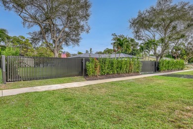 Welcome home to your resort-caliber sanctuary crafted for on Palm Beach National Golf and Country Club in Florida - for sale on GolfHomes.com, golf home, golf lot