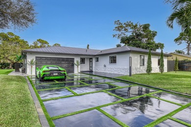 Welcome home to your resort-caliber sanctuary crafted for on Palm Beach National Golf and Country Club in Florida - for sale on GolfHomes.com, golf home, golf lot