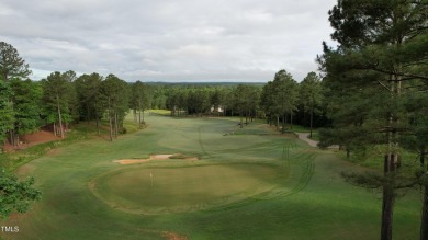 Introducing a luxurious dwelling nestled in the heart of the on Chapel Ridge Golf Club in North Carolina - for sale on GolfHomes.com, golf home, golf lot