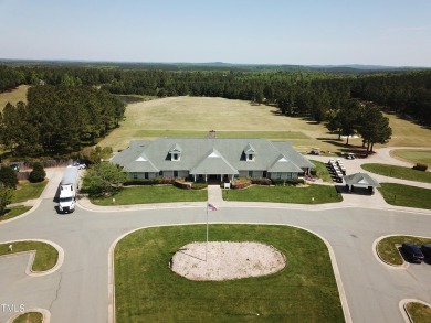 Introducing a luxurious dwelling nestled in the heart of the on Chapel Ridge Golf Club in North Carolina - for sale on GolfHomes.com, golf home, golf lot