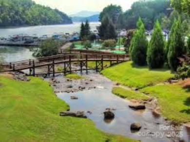 Private, LAKEFRONT LOT on beautiful Lake Lure! Located in on Rumbling Bald Resort on Lake Lure in North Carolina - for sale on GolfHomes.com, golf home, golf lot