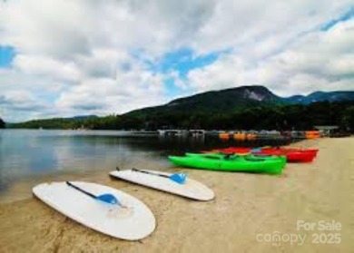 Private, LAKEFRONT LOT on beautiful Lake Lure! Located in on Rumbling Bald Resort on Lake Lure in North Carolina - for sale on GolfHomes.com, golf home, golf lot