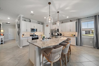 Live in luxury in this spacious 2-bedroom + den (can substitute on Esplanade Golf and Country at Lakewood Ranch in Florida - for sale on GolfHomes.com, golf home, golf lot