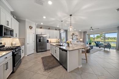 Live in luxury in this spacious 2-bedroom + den (can substitute on Esplanade Golf and Country at Lakewood Ranch in Florida - for sale on GolfHomes.com, golf home, golf lot