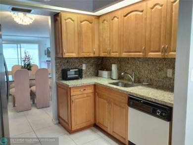 LIVE IN PRESTIGIOUS CAYMAN WAY ON AVENUE OF THE STARS! STEPS TO on Wynmoor Golf Course in Florida - for sale on GolfHomes.com, golf home, golf lot