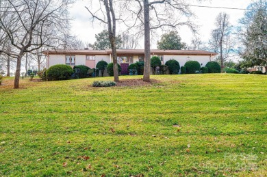 Nestled on the scenic Lake Hickory Country Club golf course on Lake Hickory Town Course in North Carolina - for sale on GolfHomes.com, golf home, golf lot