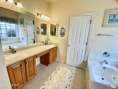 Looking for the home with a 3-car garage, water views, and golf on Sandpiper Bay Golf and Country Club in North Carolina - for sale on GolfHomes.com, golf home, golf lot