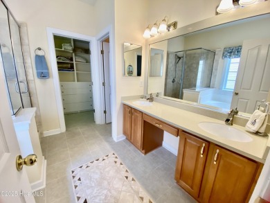 Looking for the home with a 3-car garage, water views, and golf on Sandpiper Bay Golf and Country Club in North Carolina - for sale on GolfHomes.com, golf home, golf lot