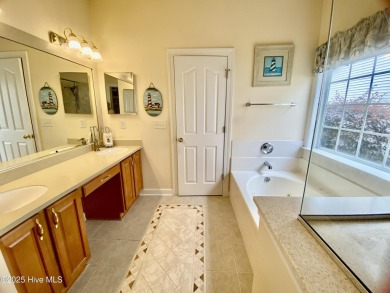 Looking for the home with a 3-car garage, water views, and golf on Sandpiper Bay Golf and Country Club in North Carolina - for sale on GolfHomes.com, golf home, golf lot