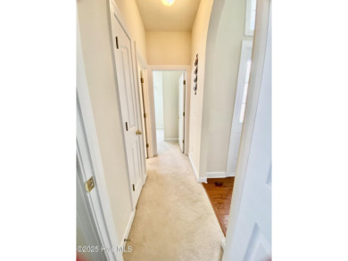 Looking for the home with a 3-car garage, water views, and golf on Sandpiper Bay Golf and Country Club in North Carolina - for sale on GolfHomes.com, golf home, golf lot