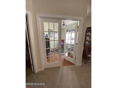 Looking for the home with a 3-car garage, water views, and golf on Sandpiper Bay Golf and Country Club in North Carolina - for sale on GolfHomes.com, golf home, golf lot