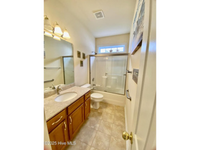 Looking for the home with a 3-car garage, water views, and golf on Sandpiper Bay Golf and Country Club in North Carolina - for sale on GolfHomes.com, golf home, golf lot