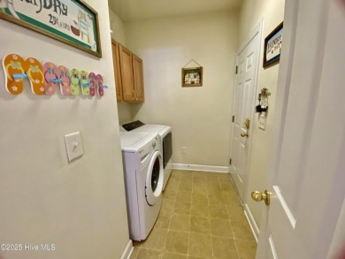Looking for the home with a 3-car garage, water views, and golf on Sandpiper Bay Golf and Country Club in North Carolina - for sale on GolfHomes.com, golf home, golf lot