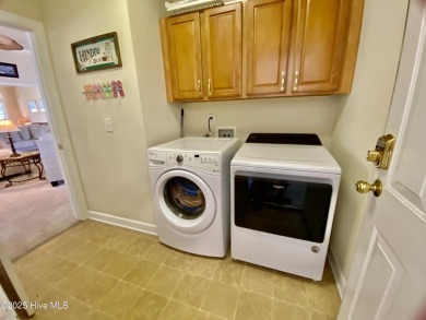 Looking for the home with a 3-car garage, water views, and golf on Sandpiper Bay Golf and Country Club in North Carolina - for sale on GolfHomes.com, golf home, golf lot
