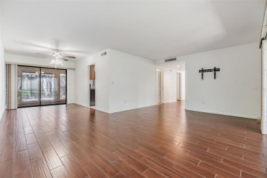 Welcome to this beautifully maintained 3-bedroom, 2-bathroom on Carrollwood Country Club in Florida - for sale on GolfHomes.com, golf home, golf lot