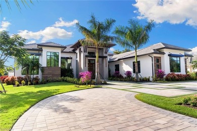 Enjoy tranquil modern elegance within this NEWLY CONSTRUCTED and on Quail West Golf and Country Club in Florida - for sale on GolfHomes.com, golf home, golf lot