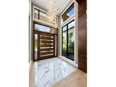 Enjoy tranquil modern elegance within this NEWLY CONSTRUCTED and on Quail West Golf and Country Club in Florida - for sale on GolfHomes.com, golf home, golf lot