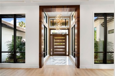 Enjoy tranquil modern elegance within this NEWLY CONSTRUCTED and on Quail West Golf and Country Club in Florida - for sale on GolfHomes.com, golf home, golf lot