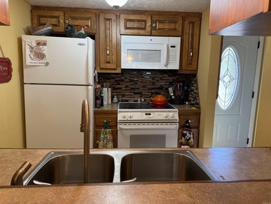 FABULOUS REMODEL on 2BR, 1.5 Ba condo just a short stroll to the on  in Arkansas - for sale on GolfHomes.com, golf home, golf lot