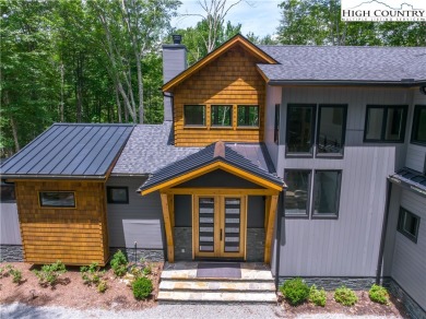 This custom built exquisite mountain modern home is one of a on Elk River Club in North Carolina - for sale on GolfHomes.com, golf home, golf lot