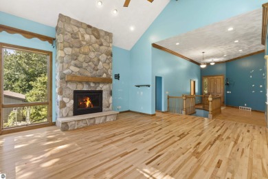 Custom-designed cedar home on over 7.5 acres with 600' of on Bear Lake Highlands Golf Course in Michigan - for sale on GolfHomes.com, golf home, golf lot