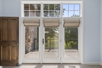 Custom-designed cedar home on over 7.5 acres with 600' of on Bear Lake Highlands Golf Course in Michigan - for sale on GolfHomes.com, golf home, golf lot
