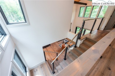 This custom built exquisite mountain modern home is one of a on Elk River Club in North Carolina - for sale on GolfHomes.com, golf home, golf lot