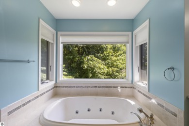 Custom-designed cedar home on over 7.5 acres with 600' of on Bear Lake Highlands Golf Course in Michigan - for sale on GolfHomes.com, golf home, golf lot