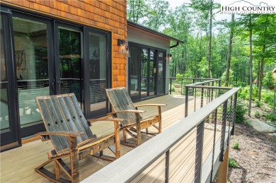 This custom built exquisite mountain modern home is one of a on Elk River Club in North Carolina - for sale on GolfHomes.com, golf home, golf lot