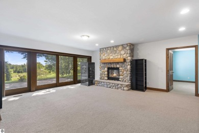 Custom-designed cedar home on over 7.5 acres with 600' of on Bear Lake Highlands Golf Course in Michigan - for sale on GolfHomes.com, golf home, golf lot