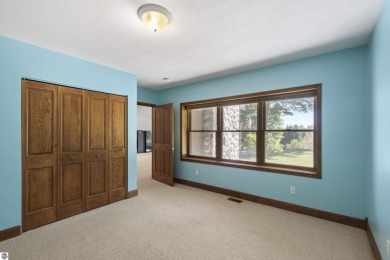 Custom-designed cedar home on over 7.5 acres with 600' of on Bear Lake Highlands Golf Course in Michigan - for sale on GolfHomes.com, golf home, golf lot